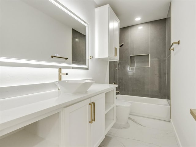 426 NW 115th St, Oklahoma City, OK 73114 - bathroom with vanity, marble look tile flooring, bathing tub / shower combination, and recessed lighting