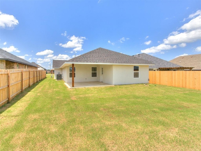 426 NW 115th St, Oklahoma City, OK 73114 - back of house featuring a fenced backyard, stucco siding, a patio, and roof with shingles