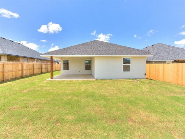 426 NW 115th St, Oklahoma City, OK 73114 - back of house featuring stucco siding, a patio area, a fenced backyard, and roof with shingles
