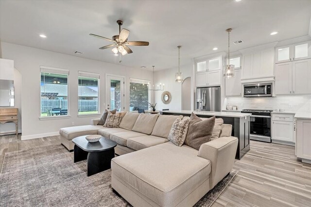 6605 NW 147th St, Oklahoma City, OK 73013 - living room featuring a ceiling fan, light wood-style floors, and recessed lighting