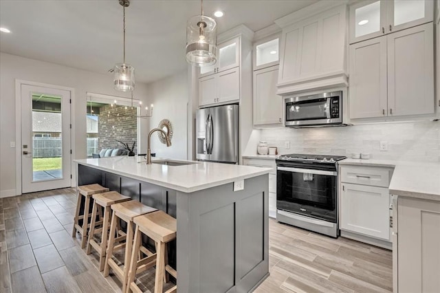 6605 NW 147th St, Oklahoma City, OK 73013 - kitchen with stainless steel appliances, decorative backsplash, recessed lighting, and a breakfast bar area