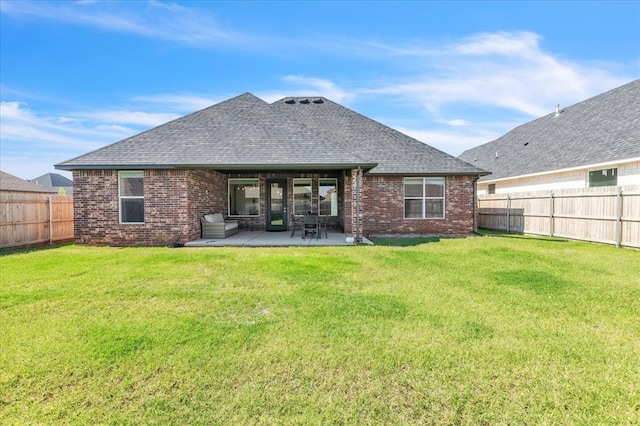6605 NW 147th St, Oklahoma City, OK 73013 - back of house featuring brick siding, roof with shingles, a fenced backyard, and a patio