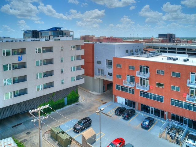 1 NE 2nd St Unit 309, Oklahoma City, OK 73104 - view of apartment building / complex featuring uncovered parking and a city view
