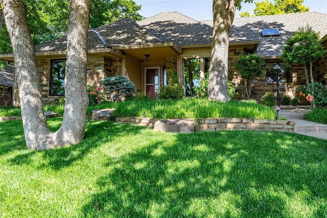 1600 Turtlecreek Rd, Edmond, OK 73013 - view of front of house with a shingled roof, a front lawn, and stone siding
