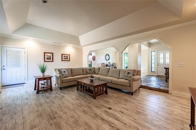 1600 Turtlecreek Rd, Edmond, OK 73013 - living area with a raised ceiling, light wood-style flooring, arched walkways, and ornamental molding