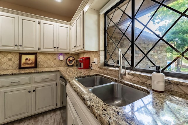 1600 Turtlecreek Rd, Edmond, OK 73013 - kitchen with white cabinets, tasteful backsplash, light stone countertops, and dishwasher