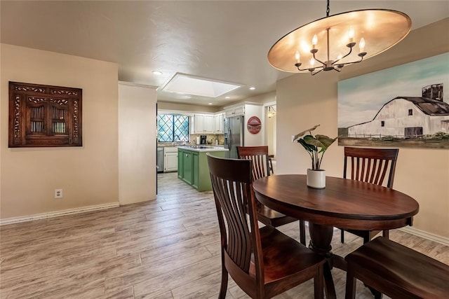 1600 Turtlecreek Rd, Edmond, OK 73013 - dining space featuring light wood-style flooring, a chandelier, and recessed lighting