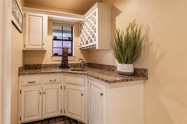 1600 Turtlecreek Rd, Edmond, OK 73013 - kitchen with white cabinetry and dark stone countertops