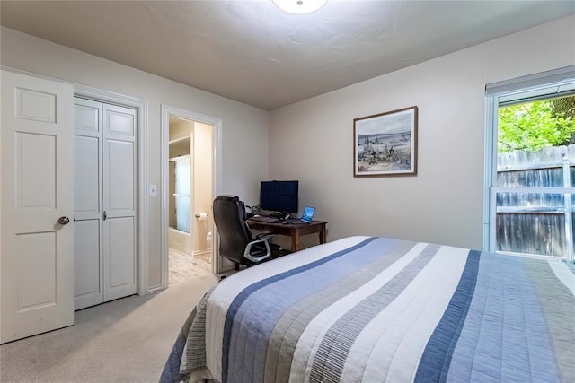 1600 Turtlecreek Rd, Edmond, OK 73013 - bedroom with light colored carpet, connected bathroom, and a desk