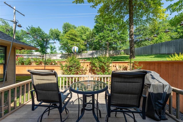 1600 Turtlecreek Rd, Edmond, OK 73013 - deck featuring a fenced backyard, outdoor dining area, and a grill