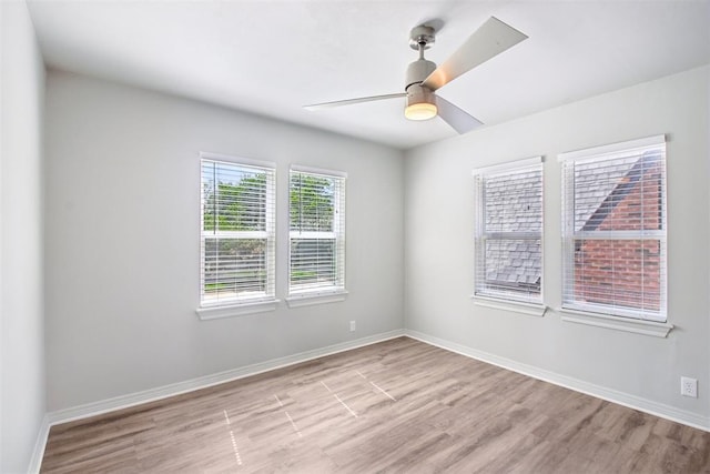 810 S Lahoma Ave, Norman, OK 73069 - spare room featuring wood finished floors and ceiling fan
