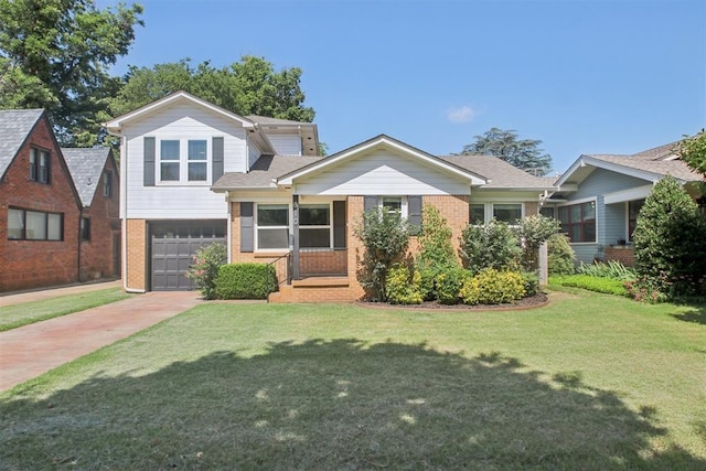 810 S Lahoma Ave, Norman, OK 73069 - view of front of home with concrete driveway, brick siding, a garage, and a front lawn