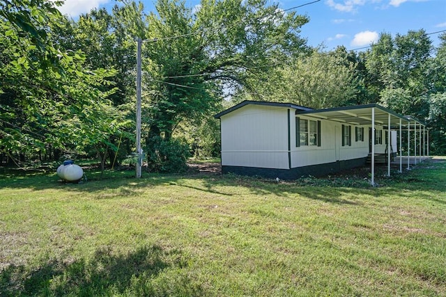 3334 N 9th Ave, Purcell, OK 73080 - view of green lawn with a carport