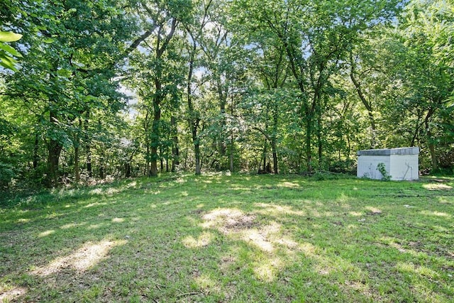 3334 N 9th Ave, Purcell, OK 73080 - view of grassy yard featuring a storage shed