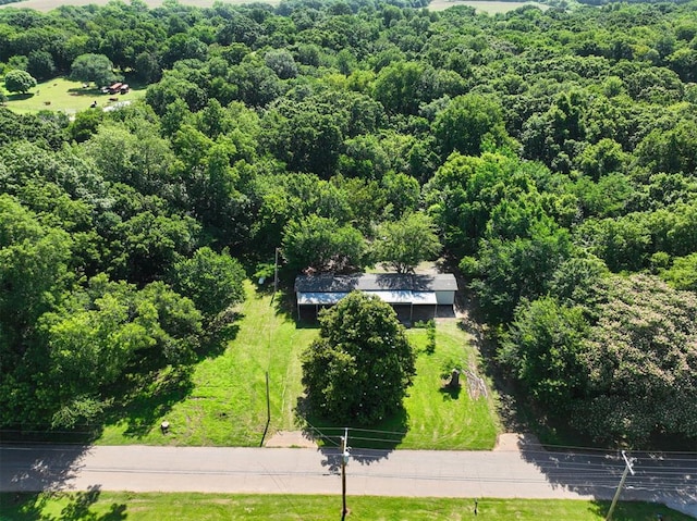 3334 N 9th Ave, Purcell, OK 73080 - aerial view of property and surrounding area with a heavily wooded area