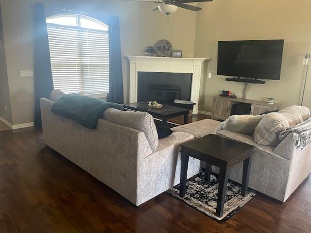 11820 SW 8th St, Yukon, OK 73099 - living area with ceiling fan, dark wood-type flooring, and a fireplace