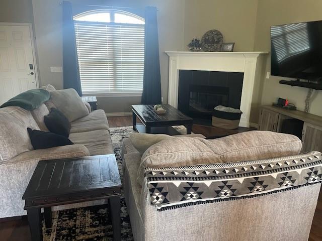 11820 SW 8th St, Yukon, OK 73099 - living room featuring wood finished floors and a tile fireplace
