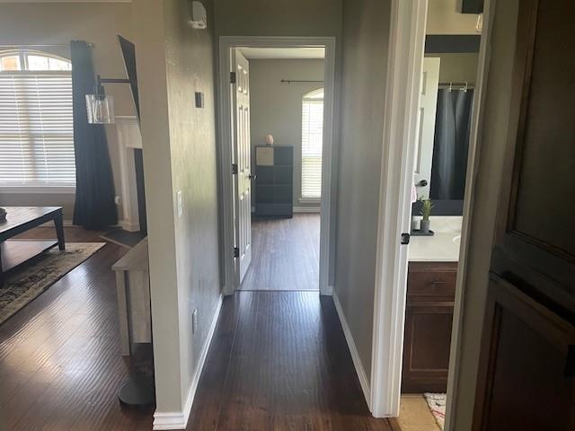 11820 SW 8th St, Yukon, OK 73099 - hall with wood finished floors and healthy amount of natural light