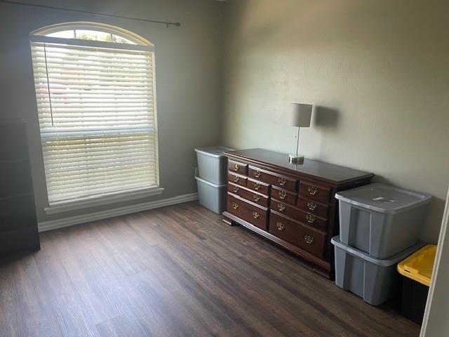 11820 SW 8th St, Yukon, OK 73099 - bedroom featuring dark wood-type flooring and baseboards