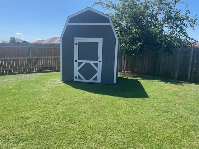 11820 SW 8th St, Yukon, OK 73099 - view of shed featuring a fenced backyard