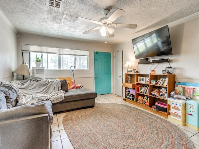 5305 S Drexel Ave, Oklahoma City, OK 73119 - living area with tile patterned flooring, ceiling fan, and a textured ceiling