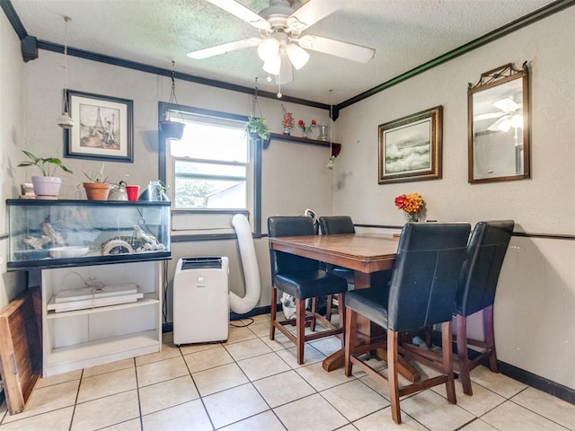 5305 S Drexel Ave, Oklahoma City, OK 73119 - tiled dining area featuring a textured ceiling, ceiling fan, and ornamental molding