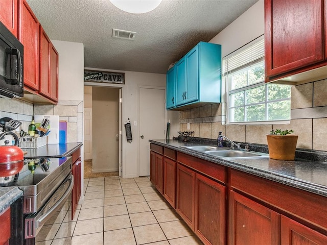 5305 S Drexel Ave, Oklahoma City, OK 73119 - kitchen featuring black microwave, electric stove, dark countertops, a textured ceiling, and decorative backsplash