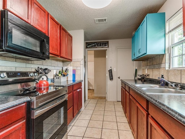5305 S Drexel Ave, Oklahoma City, OK 73119 - kitchen featuring stainless steel electric stove, black microwave, dark countertops, a textured ceiling, and decorative backsplash