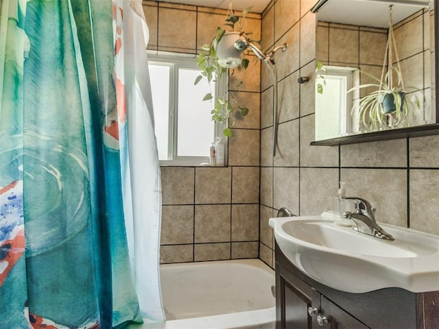 5305 S Drexel Ave, Oklahoma City, OK 73119 - bathroom featuring vanity, tile walls, and shower / bath combo with shower curtain