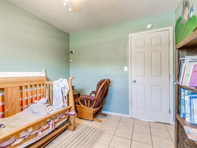 5305 S Drexel Ave, Oklahoma City, OK 73119 - bedroom with light tile patterned floors and ceiling fan