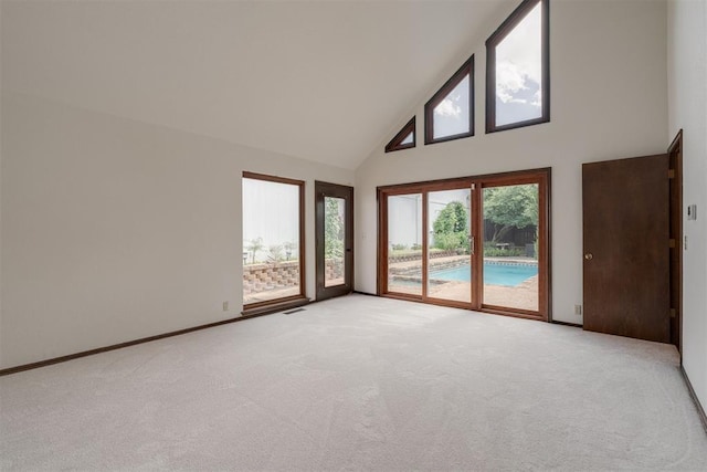 1615 Fox Hollow Rdg, Oklahoma City, OK 73131 - unfurnished room with high vaulted ceiling and light carpet