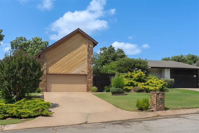 1615 Fox Hollow Rdg, Oklahoma City, OK 73131 - mid-century inspired home featuring stone siding, a garage, and driveway