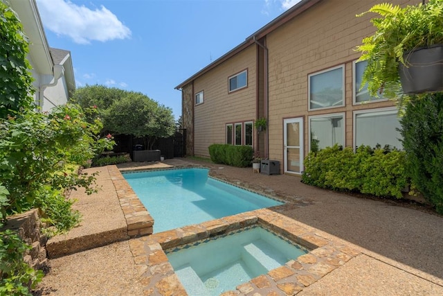 1615 Fox Hollow Rdg, Oklahoma City, OK 73131 - swimming pool featuring an in-ground hot tub, a patio area, and a fenced backyard