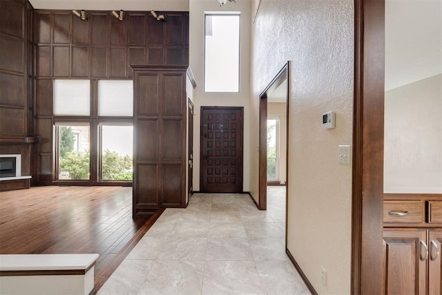 1615 Fox Hollow Rdg, Oklahoma City, OK 73131 - foyer entrance with a towering ceiling and baseboards
