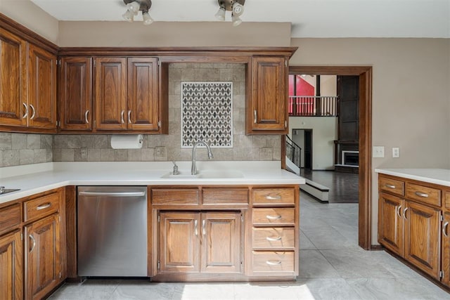 1615 Fox Hollow Rdg, Oklahoma City, OK 73131 - kitchen featuring stainless steel dishwasher and light countertops