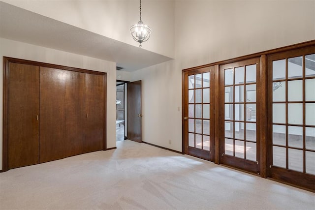 1615 Fox Hollow Rdg, Oklahoma City, OK 73131 - unfurnished bedroom featuring light colored carpet, a closet, and a high ceiling