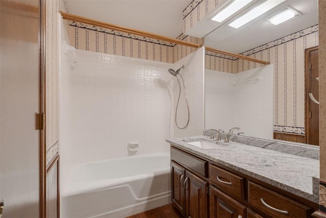 1615 Fox Hollow Rdg, Oklahoma City, OK 73131 - full bath with  shower combination, vanity, wood finished floors, and wallpapered walls