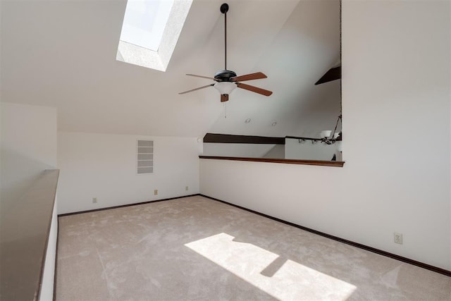 1615 Fox Hollow Rdg, Oklahoma City, OK 73131 - carpeted spare room with a skylight, lofted ceiling, and a ceiling fan