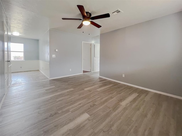 601 SE 70th St, Oklahoma City, OK 73149 - empty room with ceiling fan and light wood finished floors