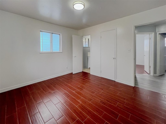 601 SE 70th St, Oklahoma City, OK 73149 - unfurnished bedroom featuring dark wood-style flooring and baseboards