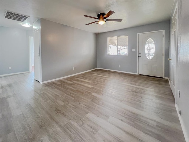 601 SE 70th St, Oklahoma City, OK 73149 - foyer entrance with ceiling fan and light wood-style floors