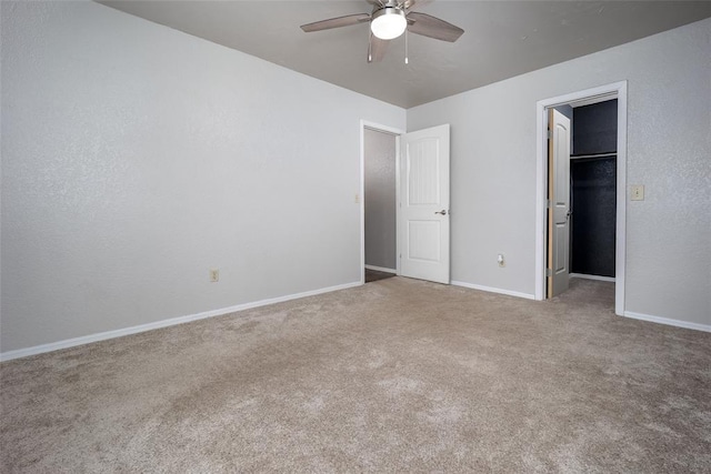 12612 Bannockburn Pl, Oklahoma City, OK 73142 - unfurnished bedroom with a spacious closet, carpet, a closet, and a ceiling fan