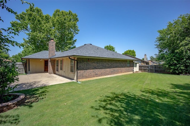 12612 Bannockburn Pl, Oklahoma City, OK 73142 - rear view of property with a patio area, a fenced backyard, a chimney, and brick siding