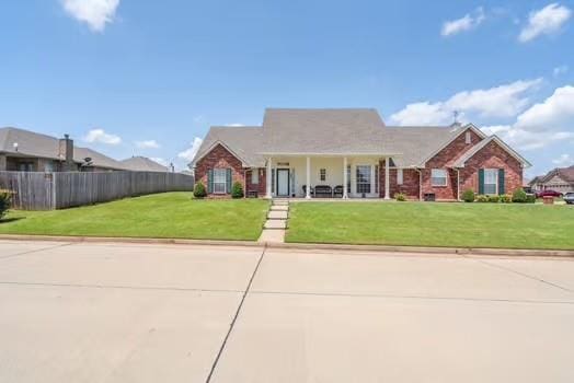 11416 Leslie Beachler Ln, Midwest City, OK 73130 - view of front of home with a porch and brick siding
