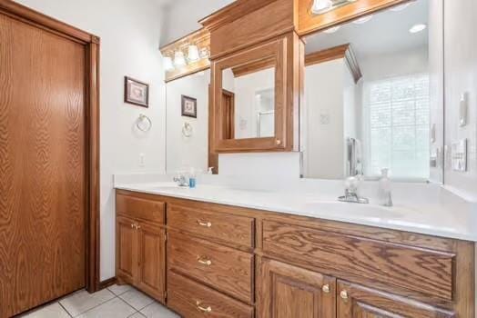 11416 Leslie Beachler Ln, Midwest City, OK 73130 - full bathroom with double vanity and tile patterned floors