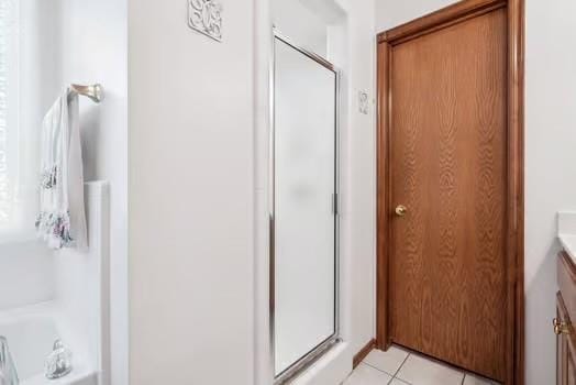11416 Leslie Beachler Ln, Midwest City, OK 73130 - bathroom with a stall shower, vanity, and tile patterned flooring