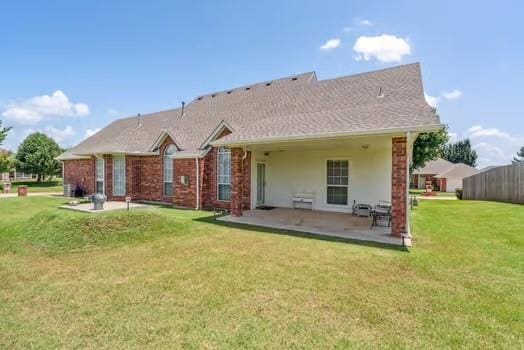 11416 Leslie Beachler Ln, Midwest City, OK 73130 - rear view of house with a patio