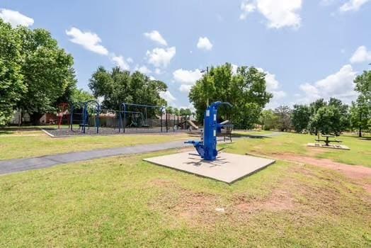 11416 Leslie Beachler Ln, Midwest City, OK 73130 - surrounding community featuring a lawn