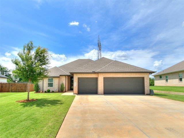 15109 Caspian Ln, Edmond, OK 73013 - view of front of house featuring an attached garage, driveway, and roof with shingles