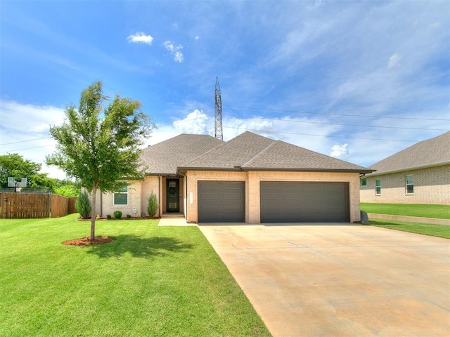 15109 Caspian Ln, Edmond, OK 73013 - view of front facade with an attached garage, concrete driveway, and roof with shingles